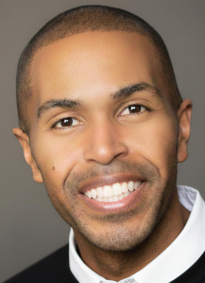 Dion Baez, Global Platform Architect and VP of Community at SoundCloud, ex Harvard, Youtube, Meta, Uber marketing executive. Dion Baez, Global Platform Architect and VP of Community at SoundCloud, posing in professional executive attire.